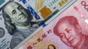 Face to face of US dollar banknote and China Yuan banknote for 2 biggest economic in the world which now United states of America and China have war trade.