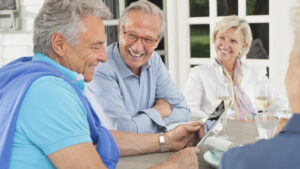Friends using digital tablet together